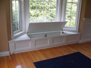 Beautifully hidden white window seat with storage!